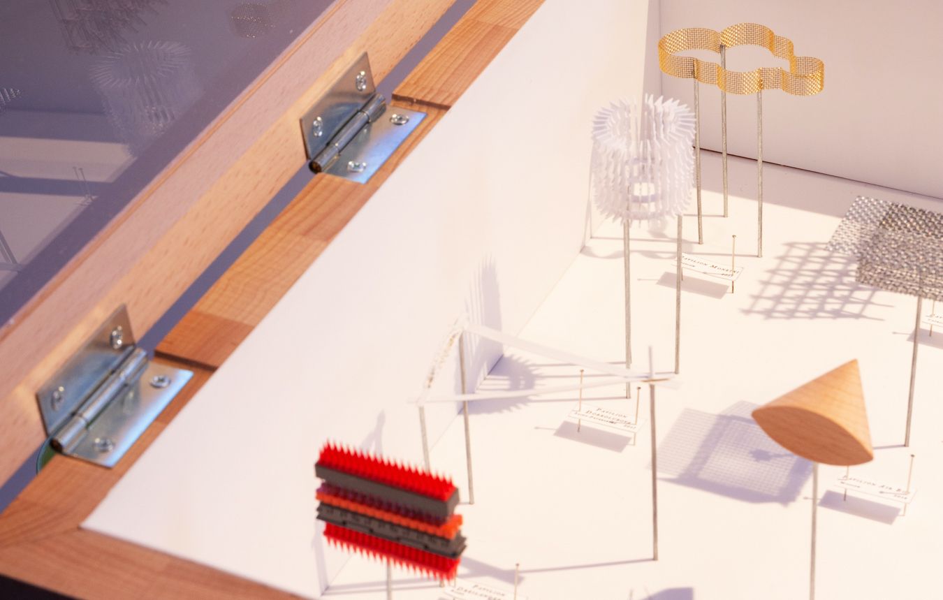 Photograph of a model with pinned architectural elements