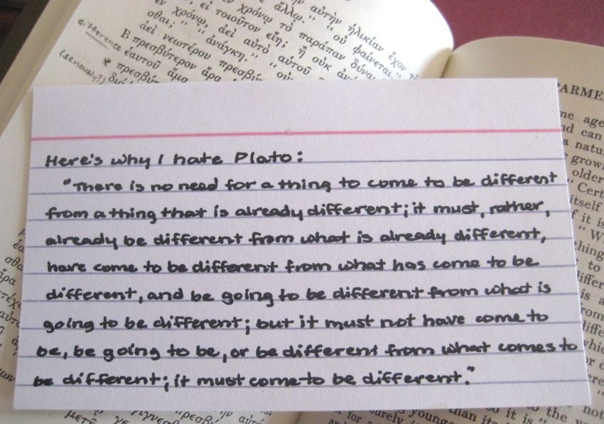 A notecard with hand-written notes discussing Plato